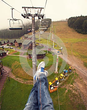 Legs in white shoes at Carpathian mountains