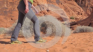 Legs Of A Woman Going In The Sand Of The Red Rock Canyon In Desert Mojave