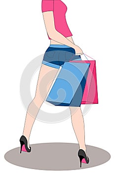 Legs of woman with shopping bags