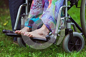 Legs of woman sitting in wheelchair