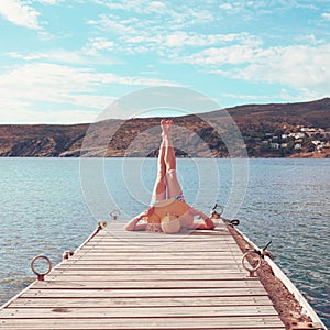 legs of woman on wooden pier