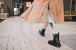 Legs of a young girl with a bionic prosthesis, back view