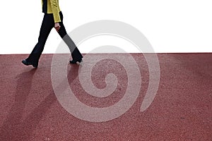 Legs of a young man in street shoes walking fast.  Fast pace of life of modern motion concept