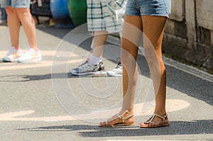 legs of young woman with hotpants