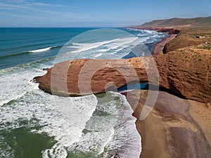 Legzira beach with arched rocks in Morocco