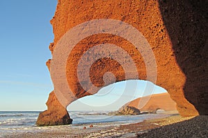 Legzira stone arc on sea beach photo