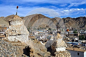 Leh town with stupas and mountains photo