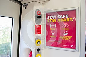 LEICESTER, ENGLAND- 3 April 2021: Coronavirus signage on a Crosscountry train amid the coronavirus pandemic