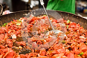 Leicester Mela Asian food cooking in large pan.