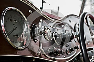 Polished wooden dash board on a vintage car at a classic car rally