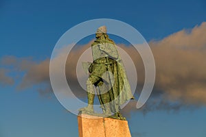 Leif Eriksson statue in Iceland against a blue cloudy sky on a sunny day