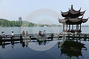 Leifeng Pagoda with stone bridge in West Lake