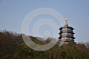 Leifeng pagoda with the trees in the foreground in Hangzhou, China.