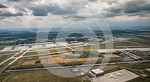 Leipzig DHL cargo hub with main buildings and cargo airplanes parked on apron - aerial view