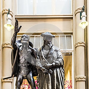 Sculpture of Mephistopheles bewitching the students in the scene Auerbachs Keller from Faust at the entrance of Auerbachs Keller