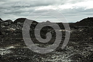 Leirhnjukur old black lava field in Iceland, overcast day in summer , moody film effect
