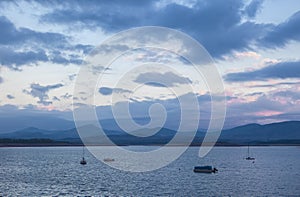 Leisure boats anchored on the shore of the Gabriel y Galan reservoir photo