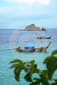 Leisure boats anchored on turquoise waters near the beach of Koh Khai island, Thailand