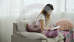 Leisure pastime casual teen girl reading diary