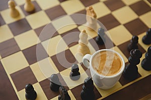 Leisure relax time or business strategy concept. Part of chess table with coffee cup