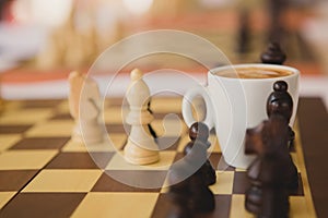 Leisure relax time or business strategy concept. Part of chess table with coffee cup