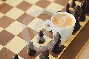 Leisure relax time or business strategy concept. Part of chess table with coffee cup