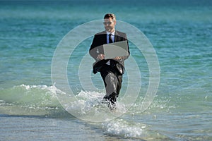 Leisure weekend and remote freelance work. Crazy comic business man in suit rest on sea bech. Funny businessman with