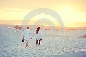 Leisurely strolls along the beach. a mature couple going for a relaxing walk on the beach.