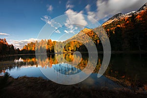 Lej Nair in engadine valley in an autumn landscape photo