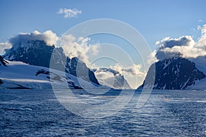 Lemaire Channel Antarctica, evening view of mountains with clouds, Antarctica