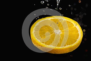 Slice of lemon surrounded by air bubbles photo