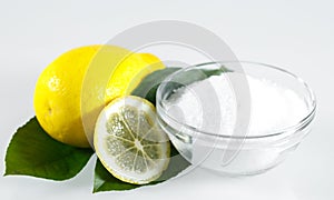 Lemon acid and lemon fruits on the white background.