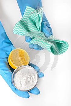 Lemon, baking soda and cleaning cloths photo