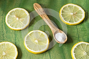 Lemon and baking soda on wooden table