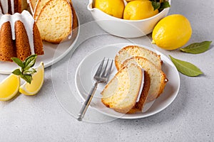 Lemon bundt cake drizzled with powdered sugar glaze