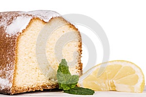 Lemon cake decorated with a lemon fruit, isolated on white