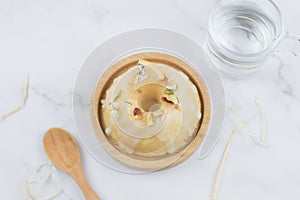 Lemon cake with sugar frosting on marble table. Healthy dessert. Delicious breakfast, traditional tea time treat.