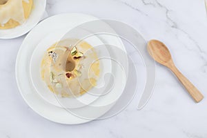 Lemon cake with sugar frosting on marble table. Healthy dessert. Delicious breakfast, traditional tea time treat.