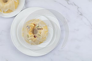 Lemon cake with sugar frosting on marble table. Healthy dessert. Delicious breakfast, traditional tea time treat.