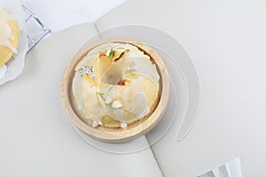 Lemon cake with sugar frosting on marble table. Healthy dessert. Delicious breakfast, traditional tea time treat.