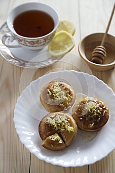 Lemon cakes, tea and honey