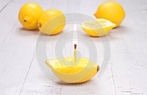 Lemon candle on wooden table