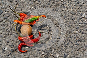 Lemon chilli bundle on the street. An old practice of throwing lemon and chilli bundle as a part of taboo in INDIA to avoid bad