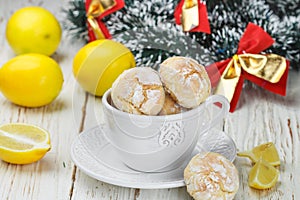 Lemon cookie with powdered sugar in a white Cup
