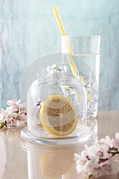 Lemon cooling drink.lemon under the cover.Morning.Glass tumbler