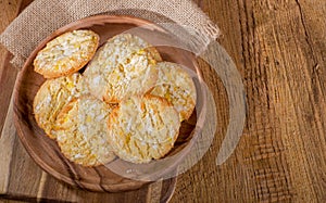 Lemon Crackle Cookies on a Wooden Plate