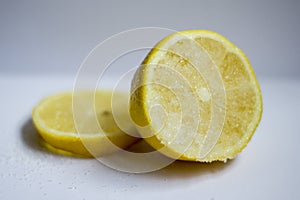 A lemon cut in a half covered in sugar