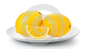 Fresh Lemon and cut half slice in plate isolated on a white background
