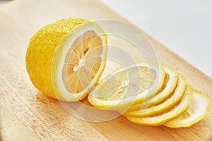 Lemon is on the cutting board.
