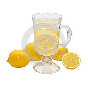 Lemon drink in a transparent glass surrounded by lemons isolated on a white background